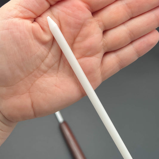1/4 inch Delrin Cane with Exotic Wood Handle shown in hand for size comparison.