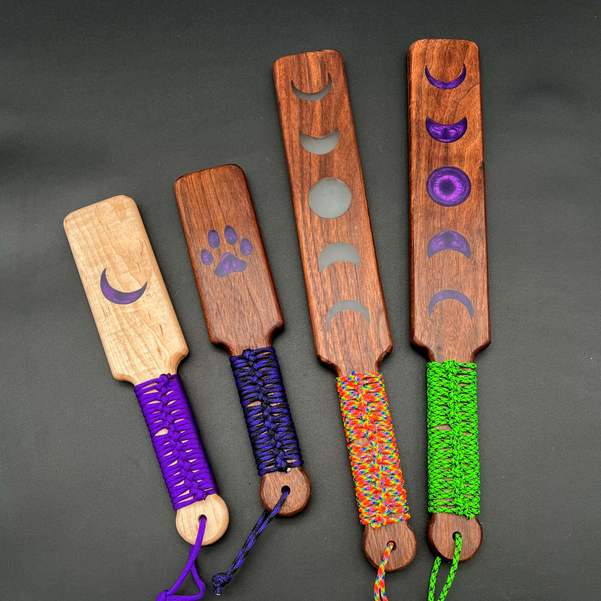 Resin Inlay Paddles featuring various shapes and colors for personalized spanking fun.
