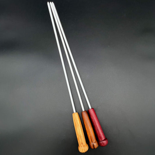 1/4 inch Delrin Cane with Exotic Wood Handle in three different styles on a black background.