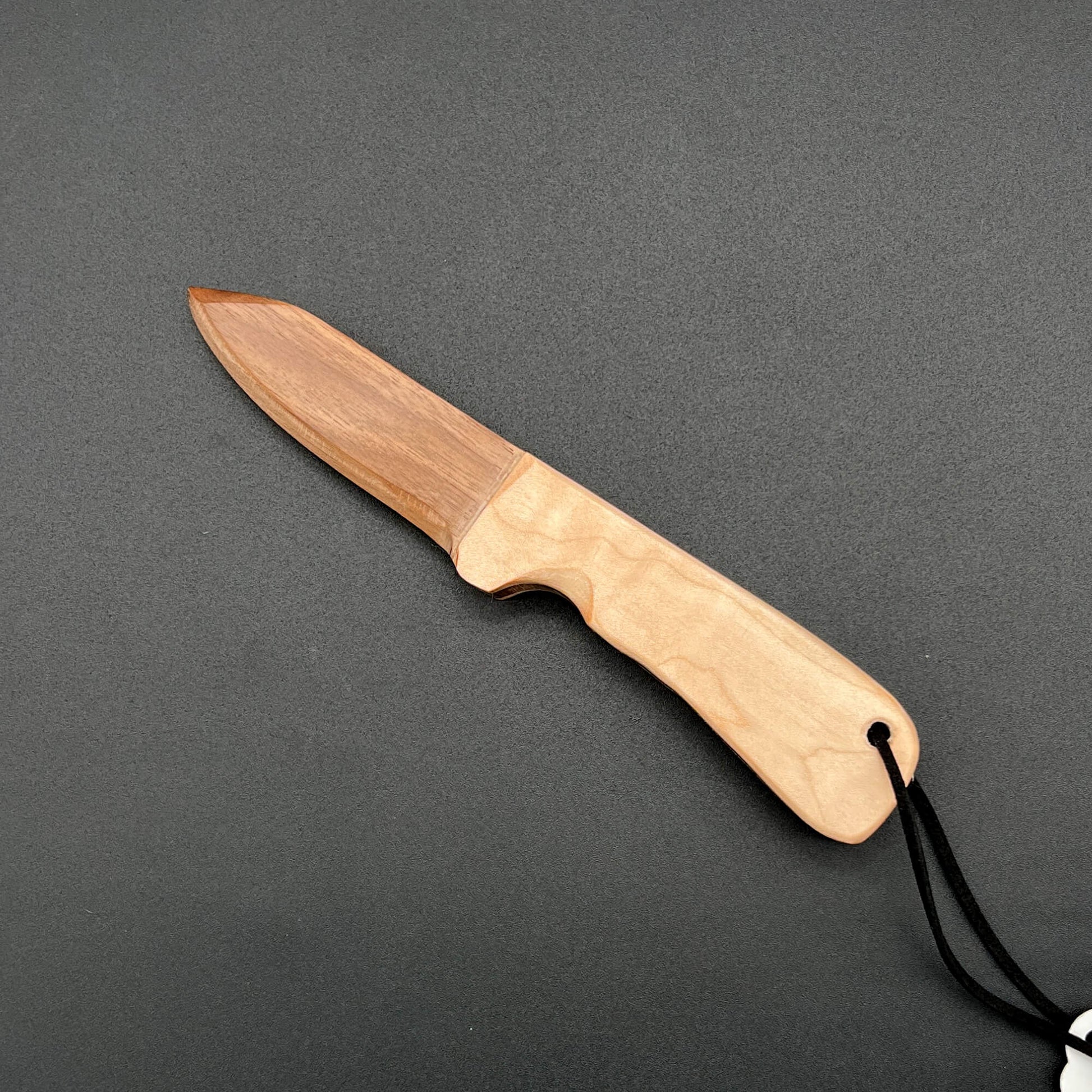 Wooden wax play knife with a blade made of Black Walnut (a dark brown wood)