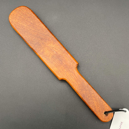 Pounder wooden paddle, simple paddle design, natural finish highlighting rich brown wood grain.