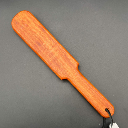 Pounder wooden paddle in rich reddish-brown color, 12 inches long, simple paddle design, finished with Wood Butter.