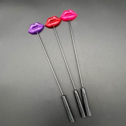 Lips Diabolical Sticks in purple, red, and pink with resin lips for a daring experience.