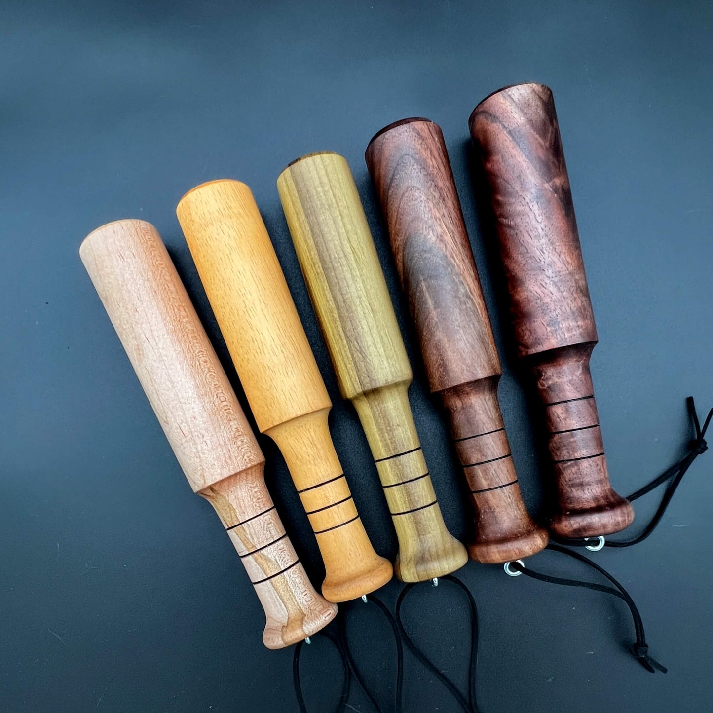 Mini Thumper product line featuring mini wooden paddles in various finishes for thuddy action.