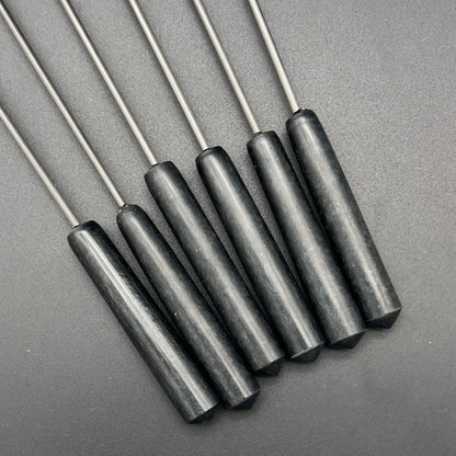 Close-up of black resin handles of Pineapple Diabolical Sticks.