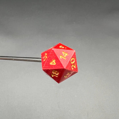 Red D20 Diabolical Sticks featuring gold numbering for TTRPG players and kinksters in action.