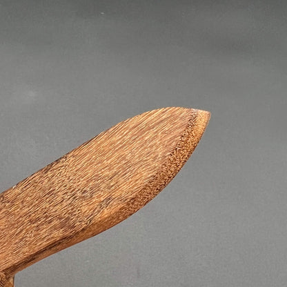 Close-up of the tip of a Spearpoint Wooden Knife designed for safe wax play and knife play.