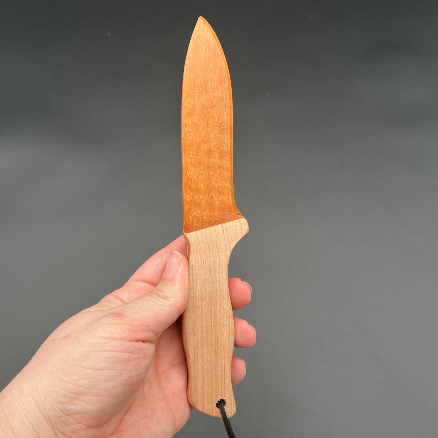 Spearpoint Wooden Knife held in hand, designed for safe wax play and knife play experiences.