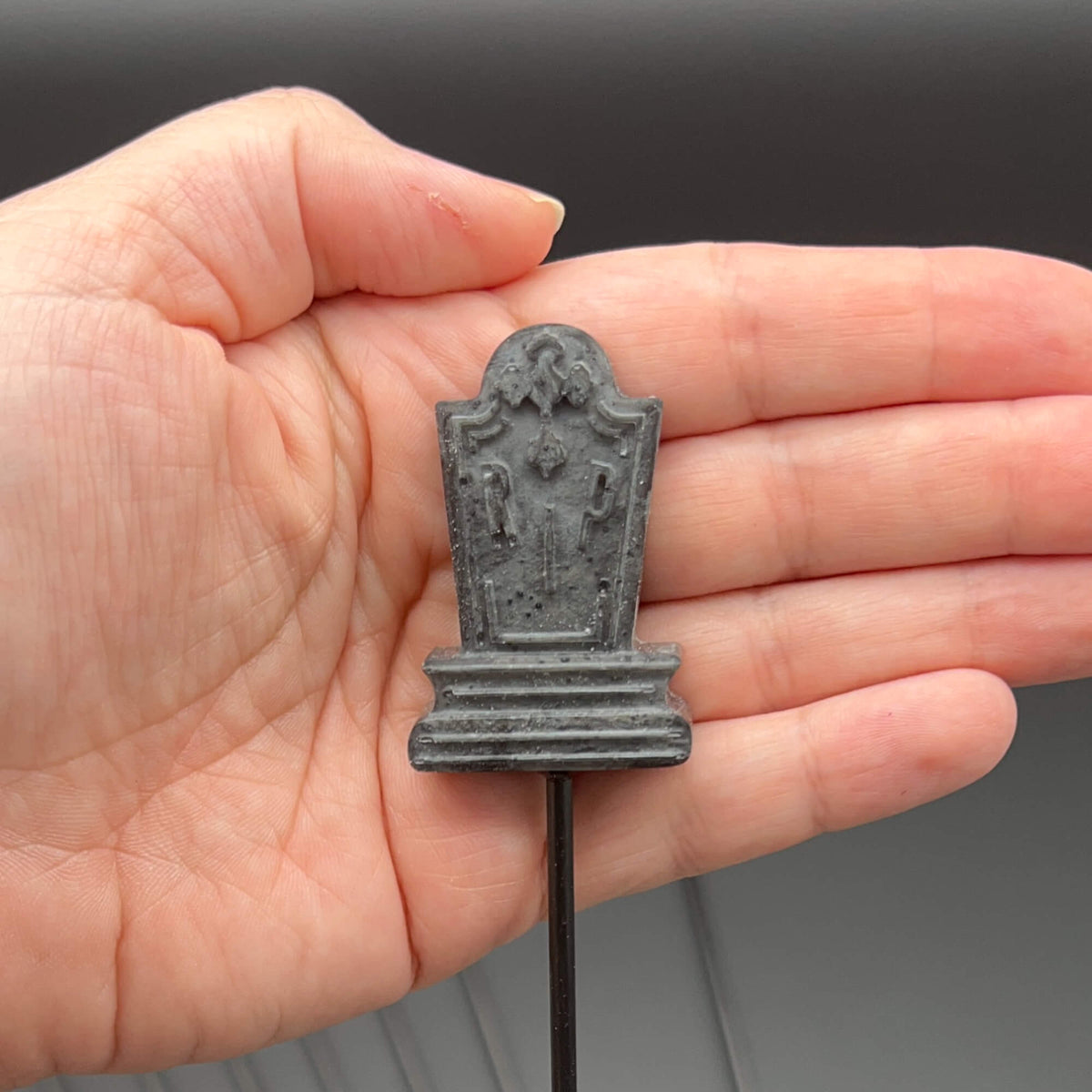 Tombstone Diabolical Stick held in a hand to demonstrate size and detail.