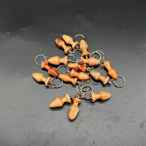 15 small butt plug keychains made from camphor wood