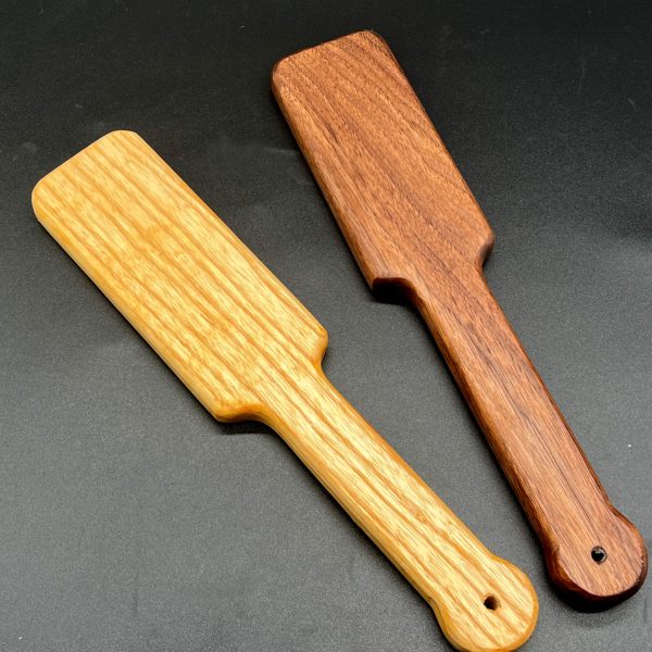 Two Ass Beater Jr paddles - Ash on the left and Black Walnut on the right