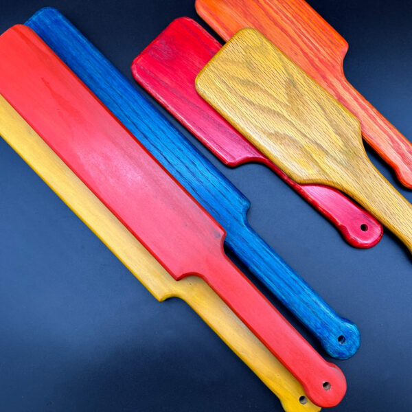 assorted paddles -- 3 long/large paddles in yellow, orange, and blue and three hairbrush style paddles in red, orange, and yellow