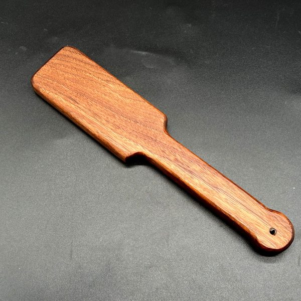 Ass Beater Jr paddle made of Black Walnut, a deep dark brown wood.