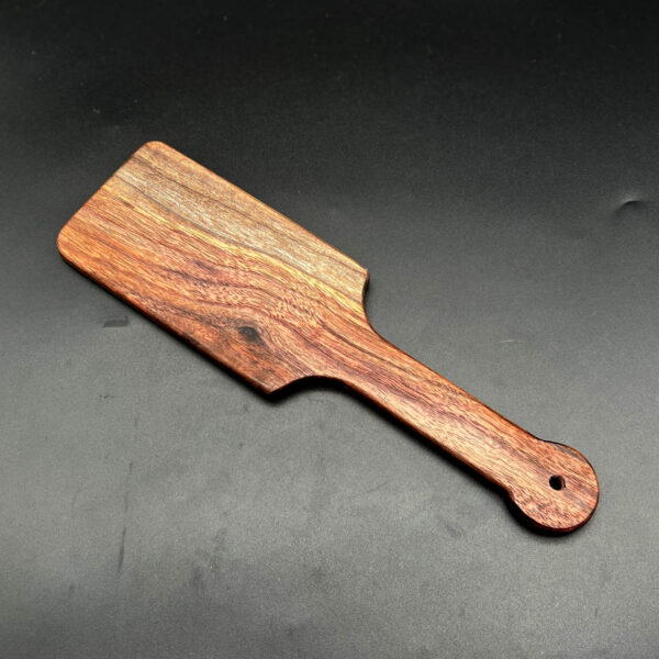 wooden paddle resembling large hairbrush made of black walnut wood