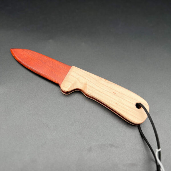 wooden knife made with a bloodwood blade, a deep red wood, with a maple blade, an almost white wood