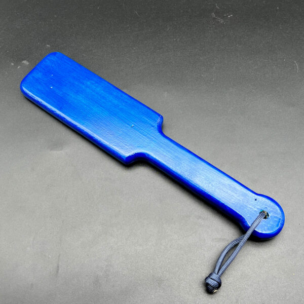 Small wooden paddle stained royal blue