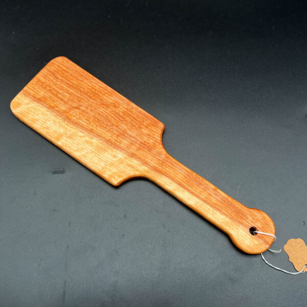 Wooden paddle made to look like large hairbrush made of curly birch
