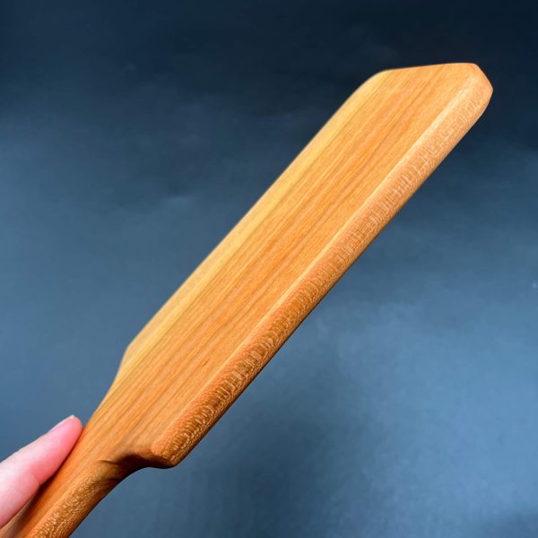 Side view of the Cherry hairbrush paddle