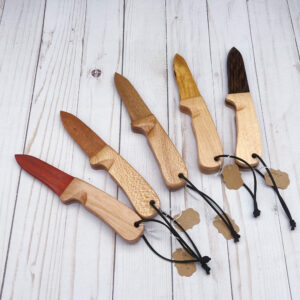 Five wooden knives: Paduak, Cherry, African Mahogany, Midori, and Wenge