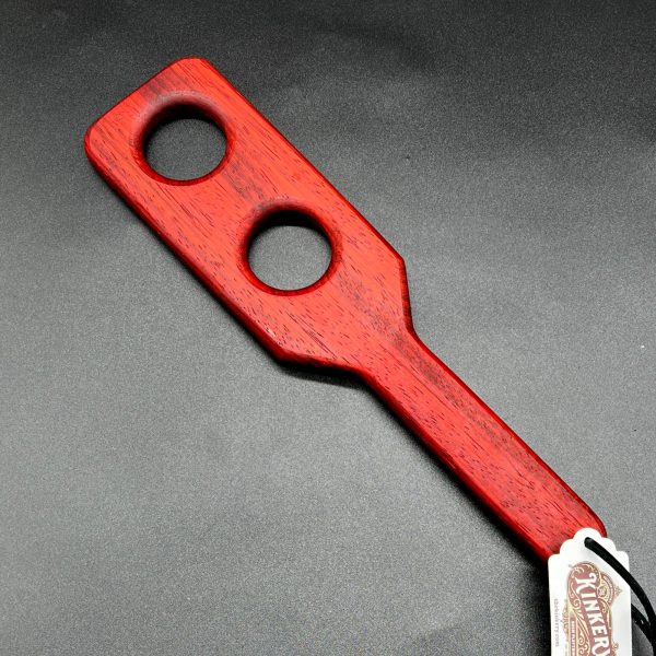 Holy Terror paddle made from Paduak, a deep red wood