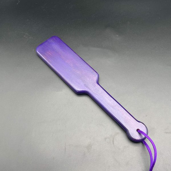 Wooden paddle stained dark purple with water base stain