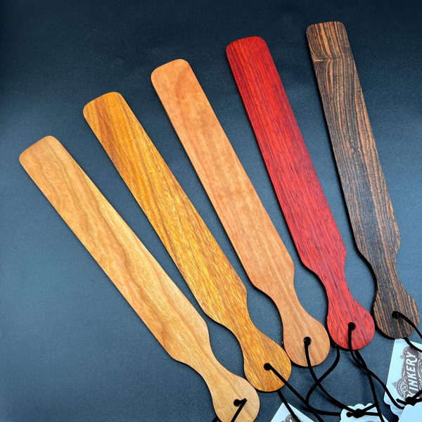 Five Slapsticks in a row. From left to right: maple, canarywood, cherry, paduak, and bocote