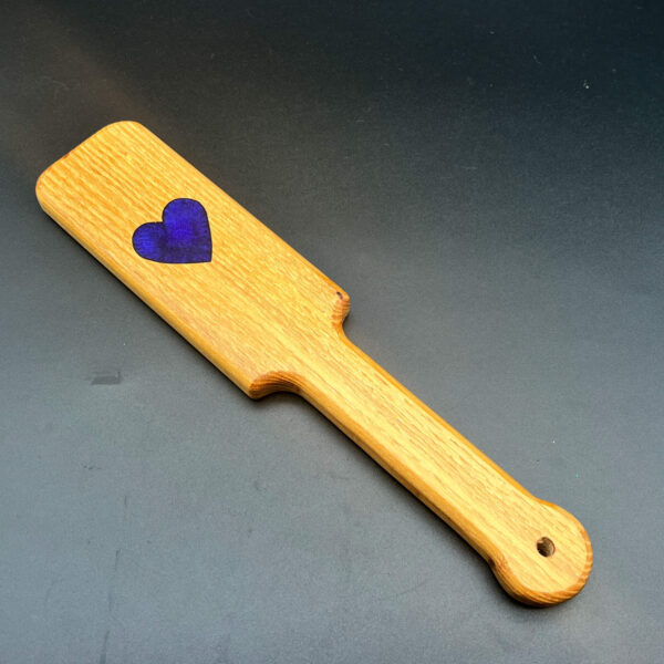 small black locust paddle with purple heart in the center