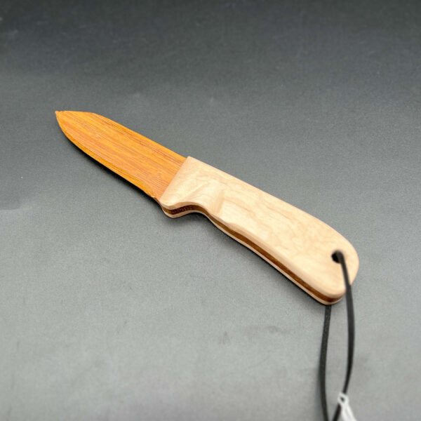 wooden knife made with honey locust wood for the blade, a light brown, almost orange wood with a maple handle, a white-yellow wood
