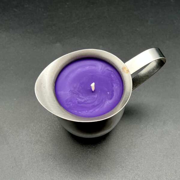 Overhead view of single large (5oz) purple soy wax play candle in silver container with handle