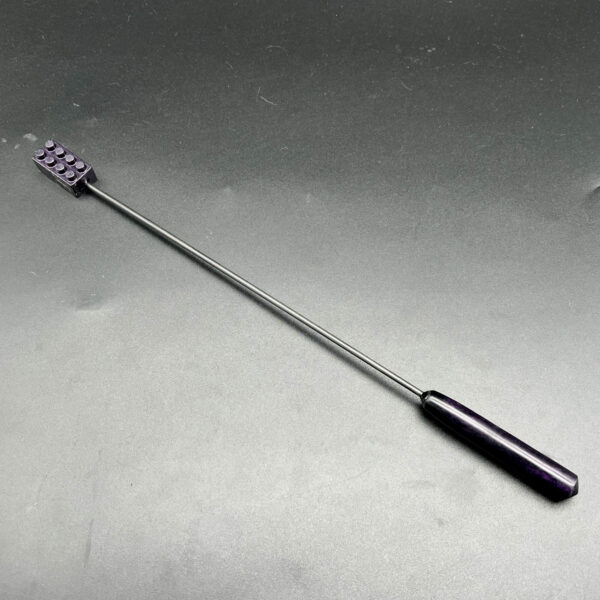 Diabolical Stick with a purple resin building brick with 8 studs on one end and a purple resin turned handle on the other