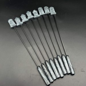 Eight tombstone diabolical sticks in a metallic silver resin with a resin handle