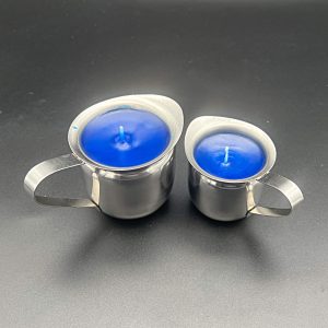 Blue paraffin wax play candles in 5 ounce (left) and 3 ounce (right) stainless steel containers with pour spouts and handles