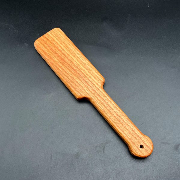 Small wooden paddle made of red oak wood