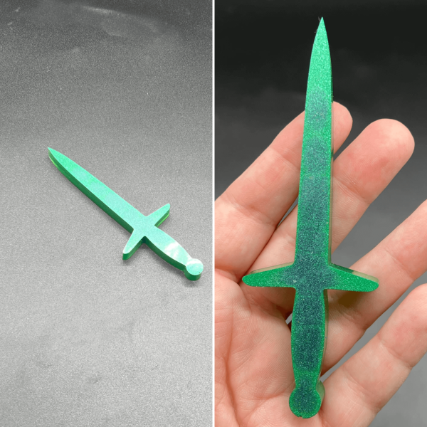 This longsword style dagger is made with primarily green resin with a few drops of blue resin that show upon the front.