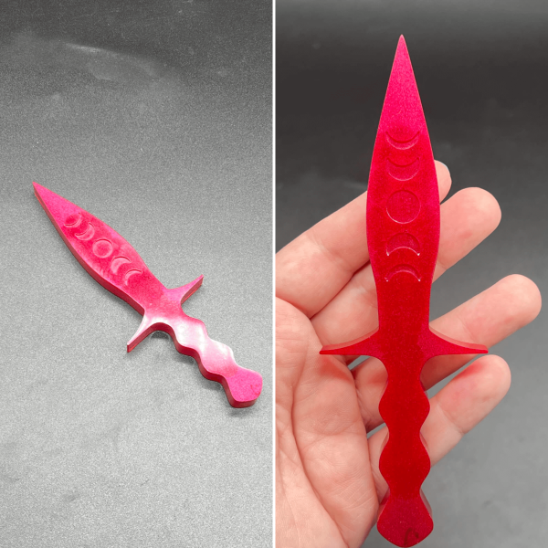 A darker hot pink resin dagger made by combining hot pink and red resin.