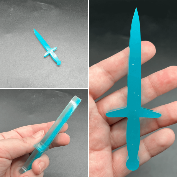 This longsword style dagger is made with a layer of glow in the dark resin and a layer of turquoise resin.