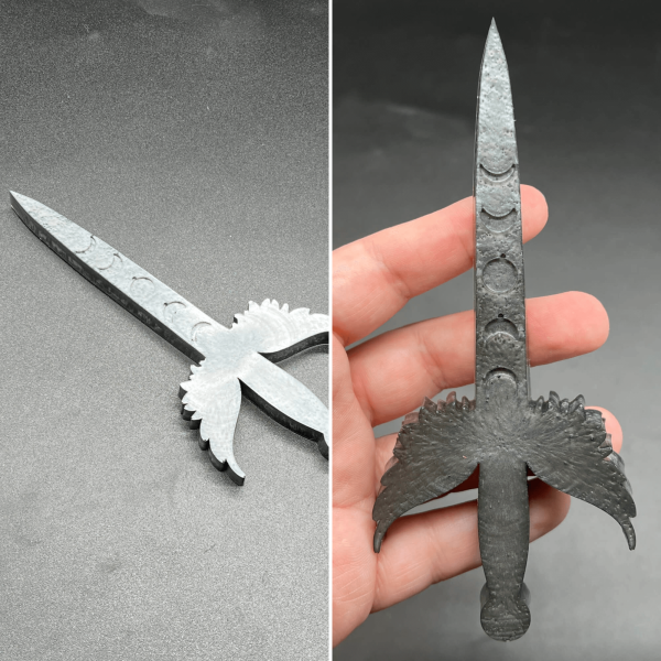 This small Poignard dagger is made with a steel gray resin.