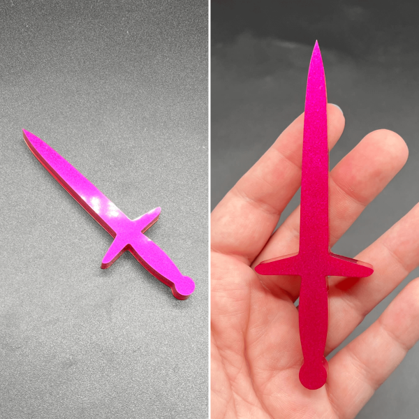 This longsword style dagger is made with hot pink resin.