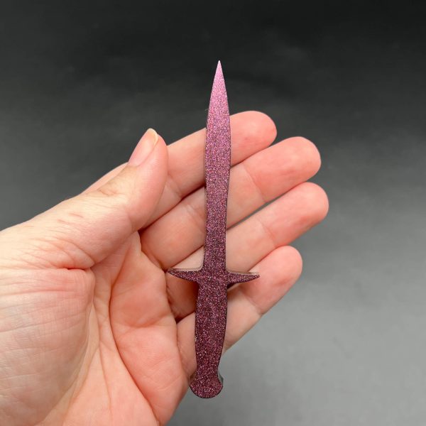 Black resin dagger with pink color shift glitter