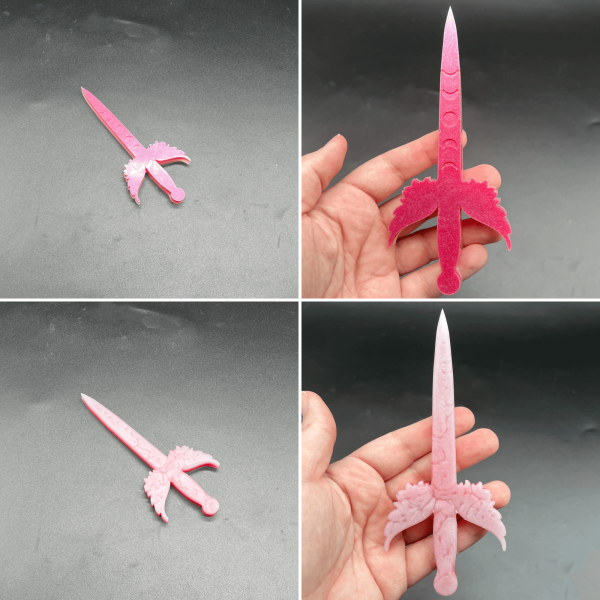 Pink and white small poignard resin dagger. Pink shows up on one side while the white is most visible on the other side