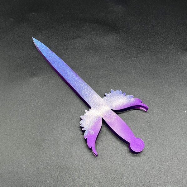 Purple resin dagger with blue-purple holographic glitter on the blade