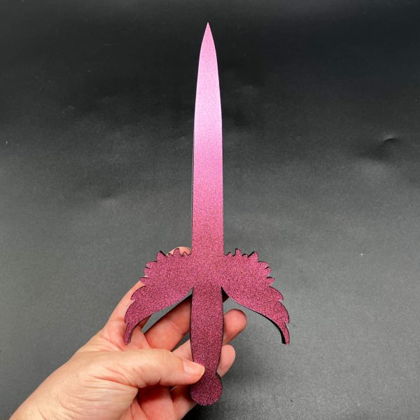 Black resin dagger with a color shift pink glitter