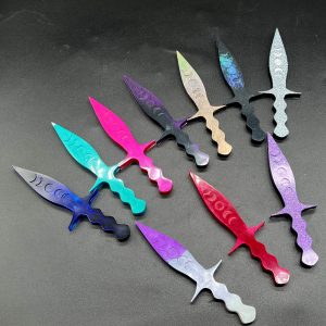 Pugio daggers. Top row, left to right: Blue, Turquoise, Pink, Purple and Black, Bronze Holo, Black Holo, Silver Sparkle. Bottom row, left to right: Purple and white, Red and Hot Pink, Purple Sparkle