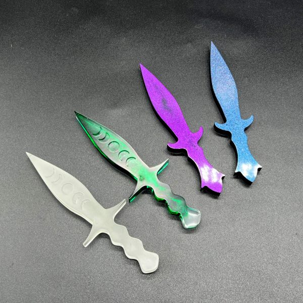 4 Pugio daggers - two with the moon phase: glow in the dark and translucent green; two without the moon phase designs: purple and black and black with a blue colorshift glitter