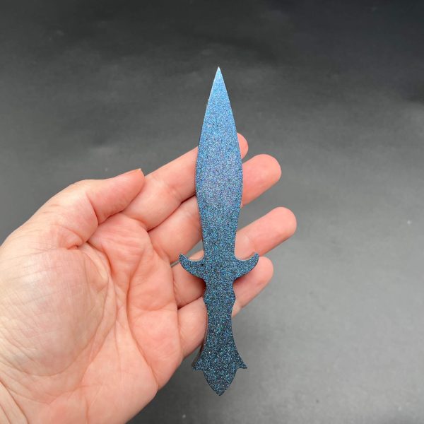 Black resin dagger with a blue color shifting glitter