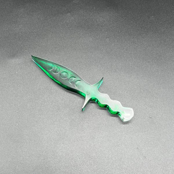 Clear resin dagger with swirls of translucent green