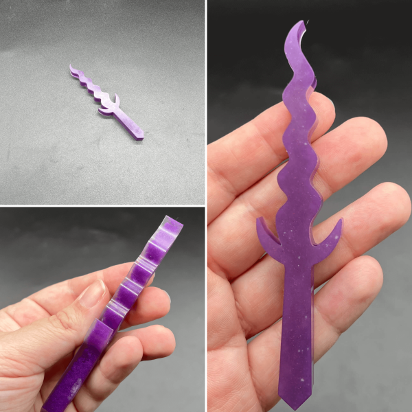 A Kris style dagger made with purple resin and a thin layer of clear resin.