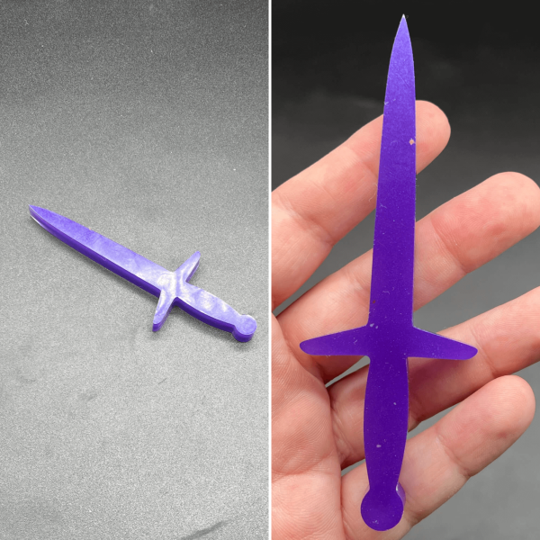 This longsword style dagger is made with purple resin and a layer of clear resin across the front side.