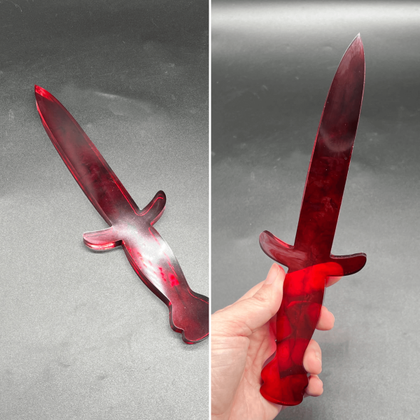 Clear resin dagger with swirls of translucent red