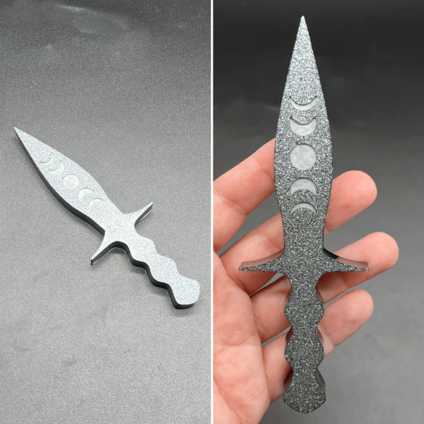 This is a sparkly silver dagger on the front and black on the back.